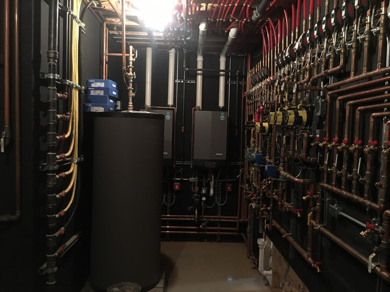 Boiler and mechanical room with copper piping installed by Visentin